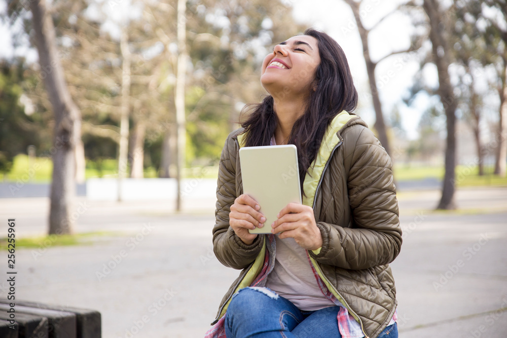 Ecstatic girl with tablet excited about good news Ecstatic girl with tablet excited about good news