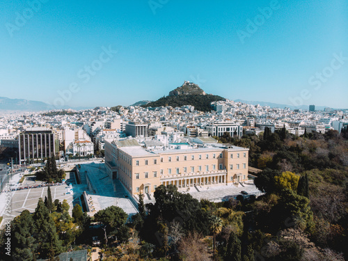 City views of day time with acropolis on a hill at the horizon  Athens  Greece