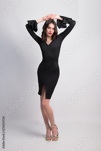 classic woman's fashion little black dress  beautiful fashion model posing universal style  must have in wardrobe day and night dress