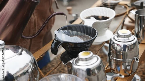 Pouring hot water on coffee filter, drip coffee.