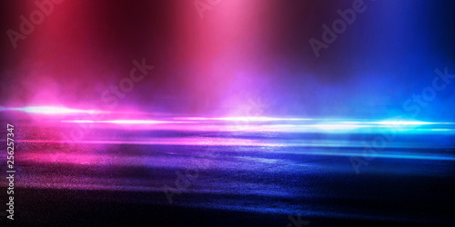 Background of the room with concrete pavement. Blue and pink neon light. Smoke  fog  wet asphalt with reflection of lights. Abstract light  searchlight rays. Night view of the street with lights  dark