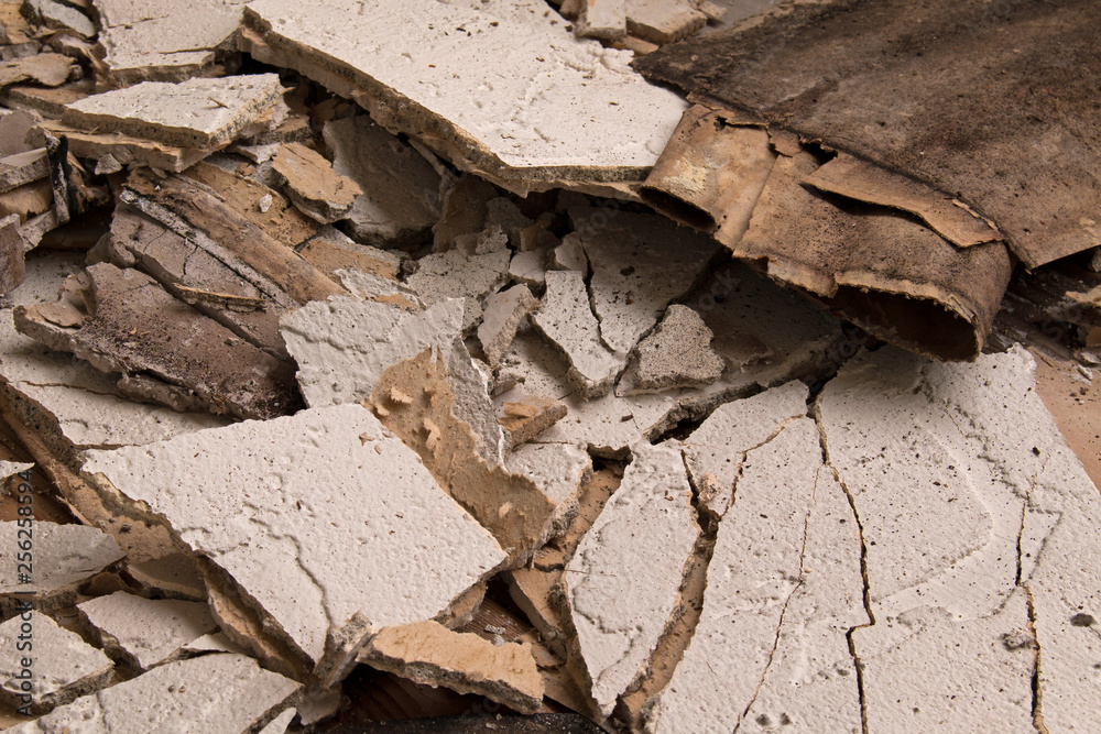 Pieces of broken stucco caused by water damage Pieces of broken stucco caused by water damage