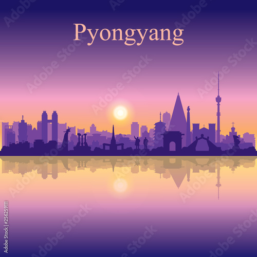 Pyongyang city silhouette on sunset background