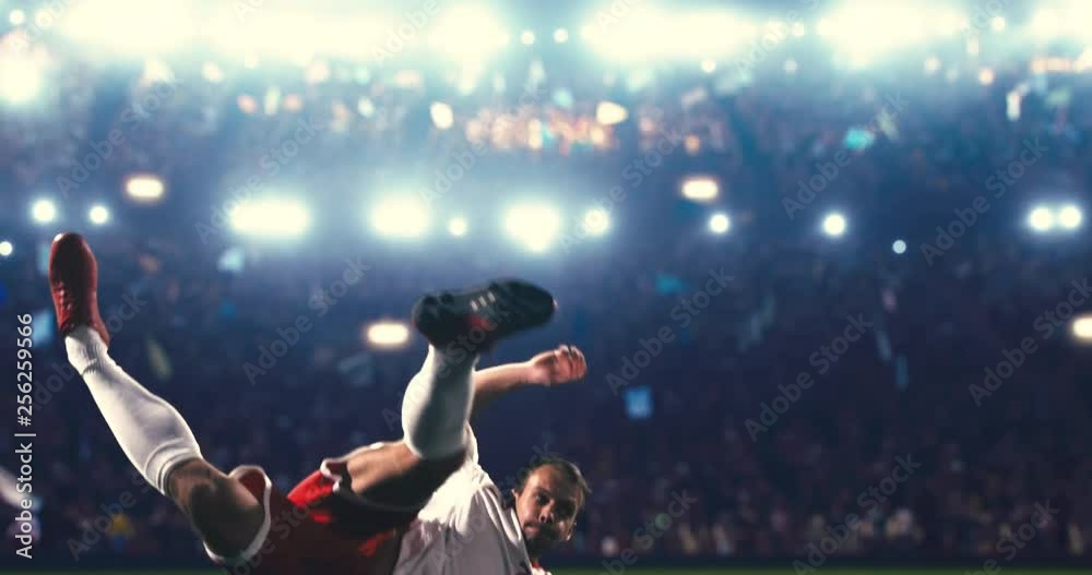 Soccer player succeed in making a strong kick with his feet while jumping horizontally. The players is wearing unbranded soccer uniform.Stadium and crowd are made in 3D and animated.