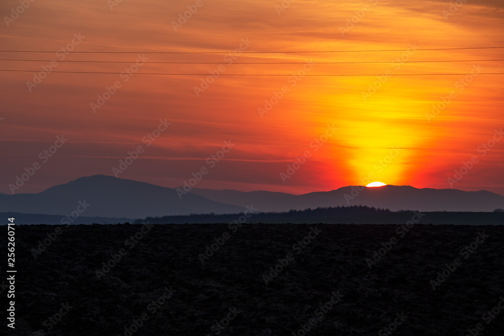 Spectacular sunset over plowed agricultural field in Southern Bulgaria
