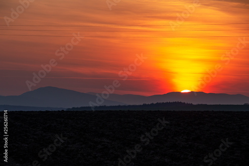Spectacular sunset over plowed agricultural field in Southern Bulgaria