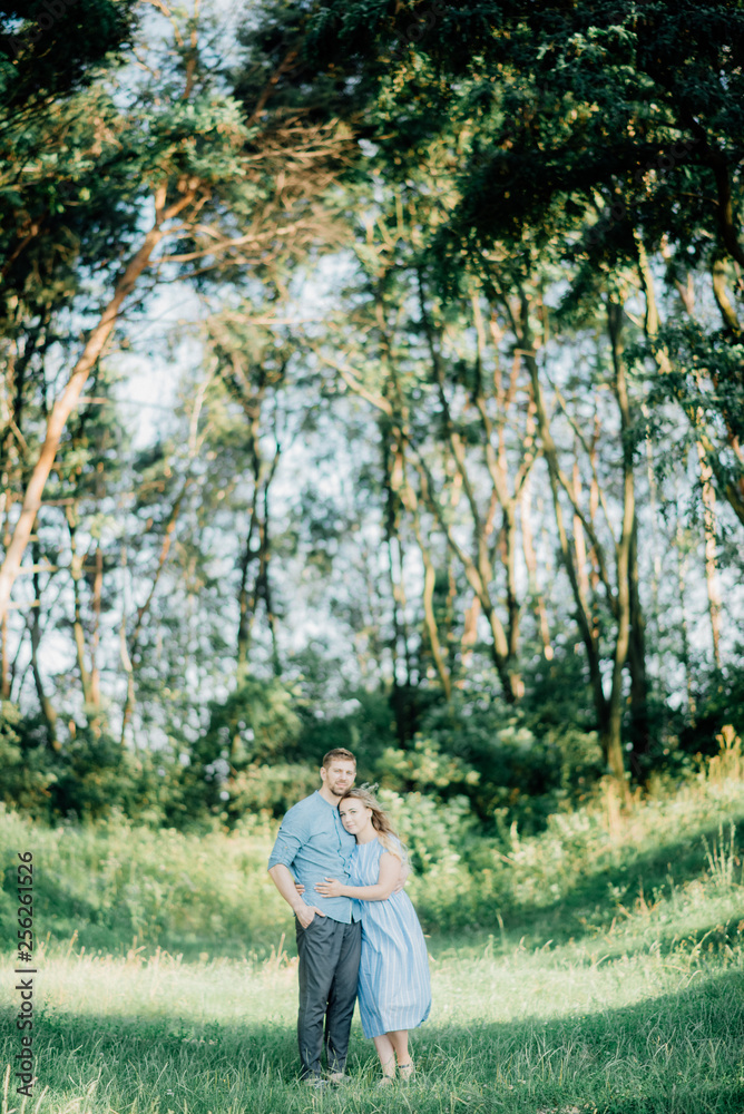 Happy young family spending time together outside in green nature Happy young family spending time together outside in green nature
