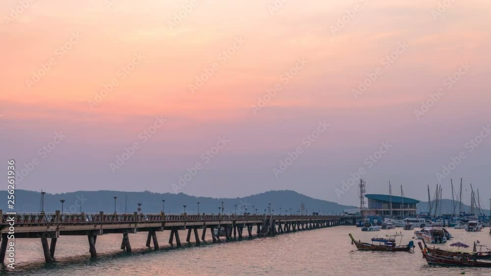 time lapse stunt sunrise Chalong pier. Chalong pier very important for travel business it is a center for all boat .and yacht marina there have two piers for transport service tourists time lapse stunt sunrise Chalong pier. Chalong pier very important for travel business it is a center for all boat .and yacht marina there have two piers for transport service tourists