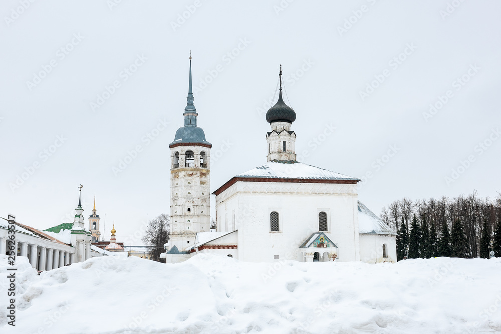 White stone church on the central square of Suzdal in winter White stone church on the central square of Suzdal in winter