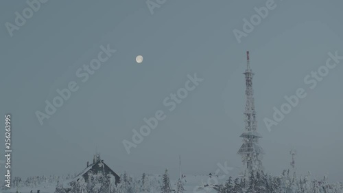 Wallpaper Mural Aerial drone view of shelter and transmitter tower at sunrise in winter in mountains with full moon in background  Torontodigital.ca
