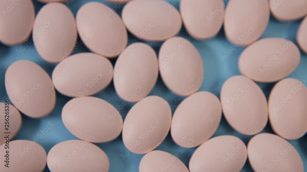 pink oval pill for pregnant women lying