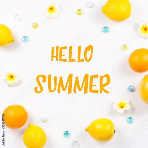 Hello summer greeting card with citrus fruits and flowers. Tropical summer concept, beach destination