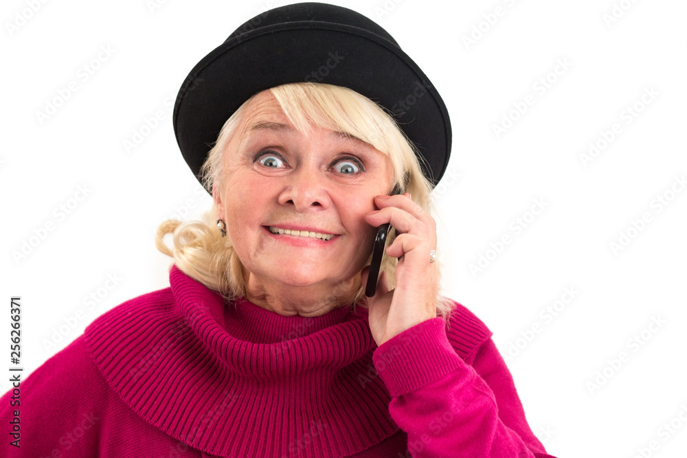 Senior lady is holding cellphone. Smiling elderly woman isolated. Most affordable tariffs. Senior lady is holding cellphone. Smiling elderly woman isolated. Most affordable tariffs.