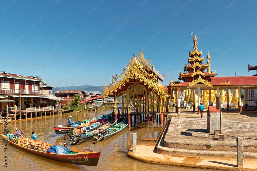 Burma, Asia -  gilded pagodas by the lake.