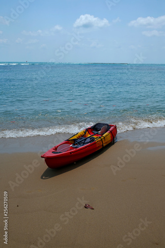 red kayak on the beach