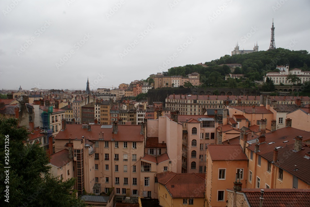 rooftops and view of the city on a rainy day, sunset in Lyon France
