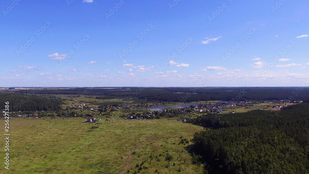 Landscape and a small village on the river from a height