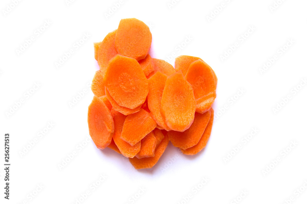 Fresh carrot sliced into thin slices on a white background