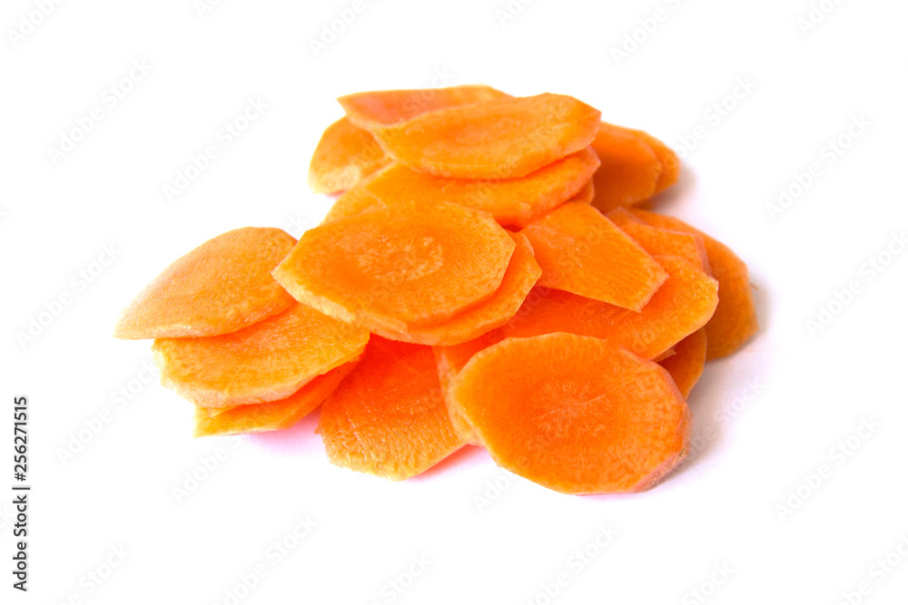 Fresh carrot sliced into thin slices on a white background