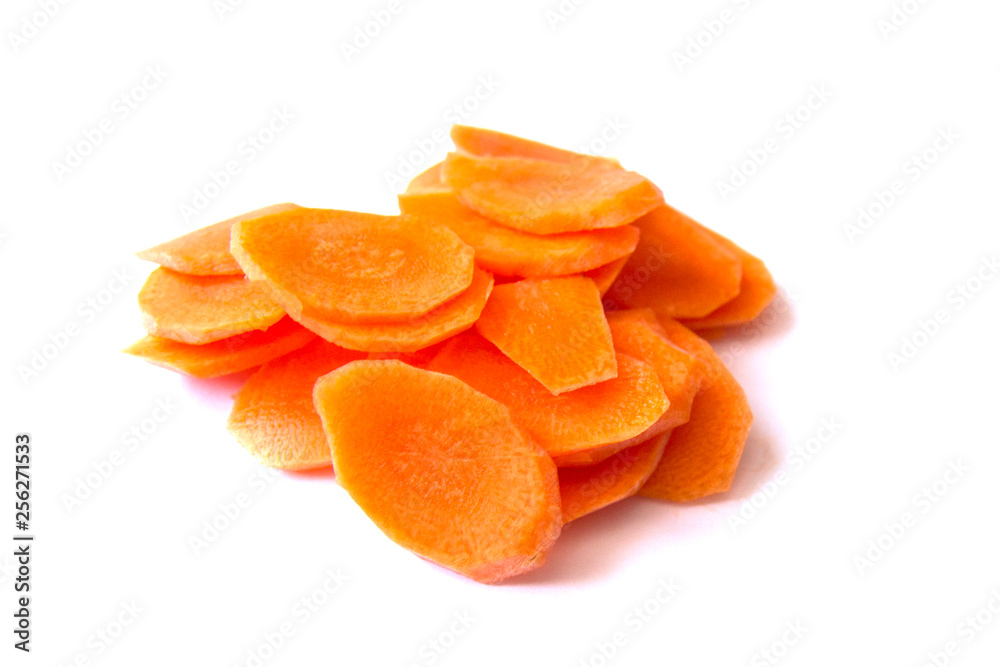 Fresh carrot sliced into thin slices on a white background