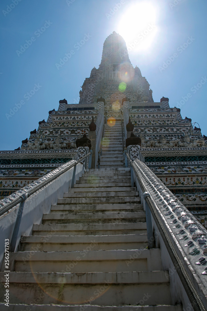 Wat Arun (Temple of Dawn) in Bangkok, Thailand with colorful lens flares