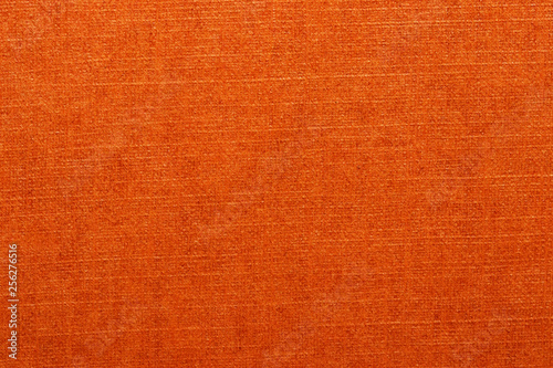 Orange texture. Closeup of a bright seamless orange paper or carton detail texture background for design and text. Macro.