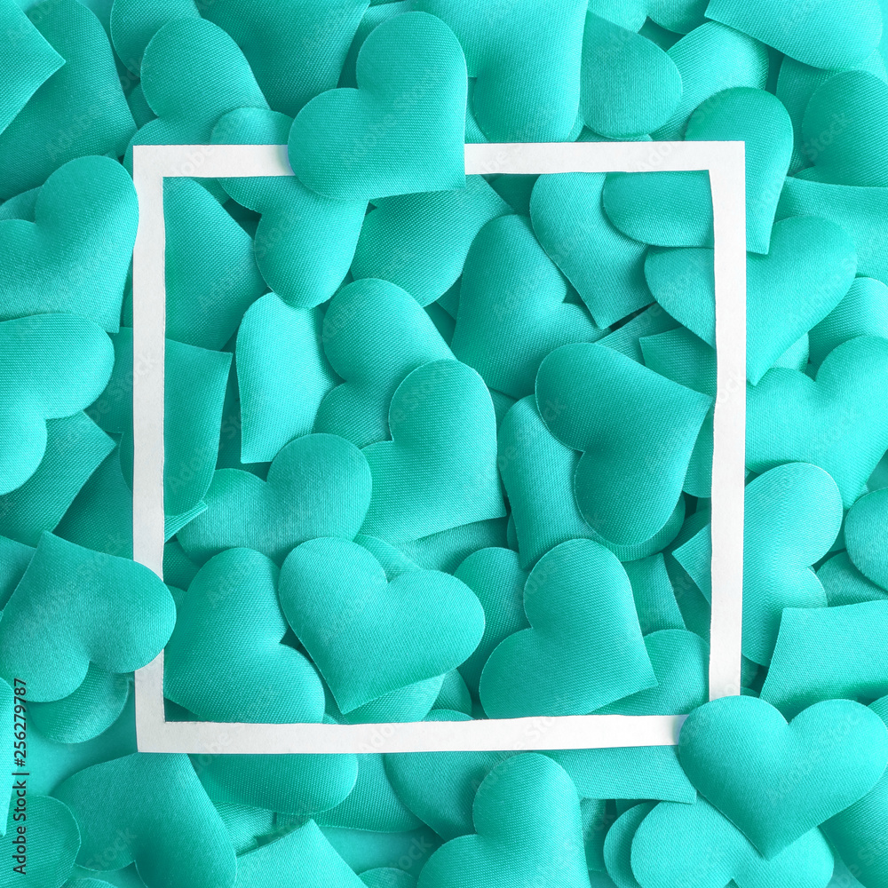Obraz premium Love concept made of small hearts in turquoise color and frame abstract.