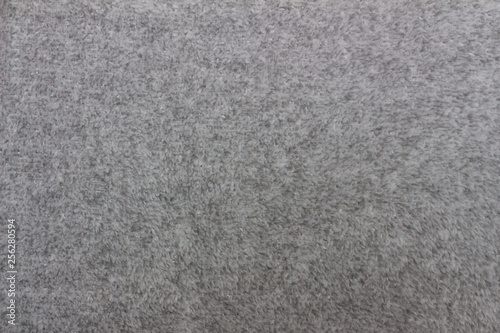 Gray blanket texture for background. Close-up of natural warm wool coverlet, wrap, coverlid. Original pattern