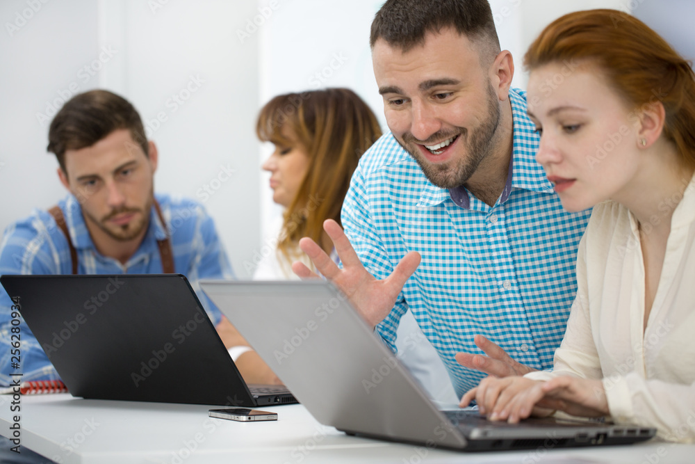 Businessman working with his female colleague Businessman working with his female colleague
