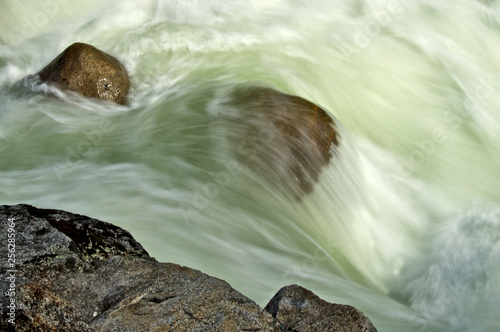 Fast flowing water and Boulders, Stanislaus River, California  photo