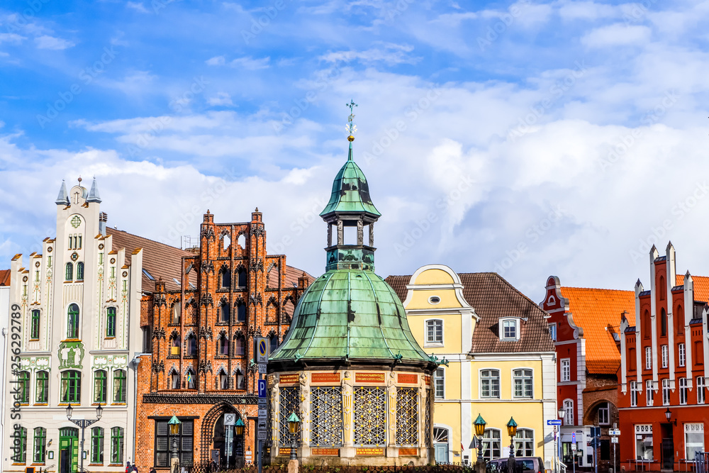 Wismar on the market square with water art and historic facades