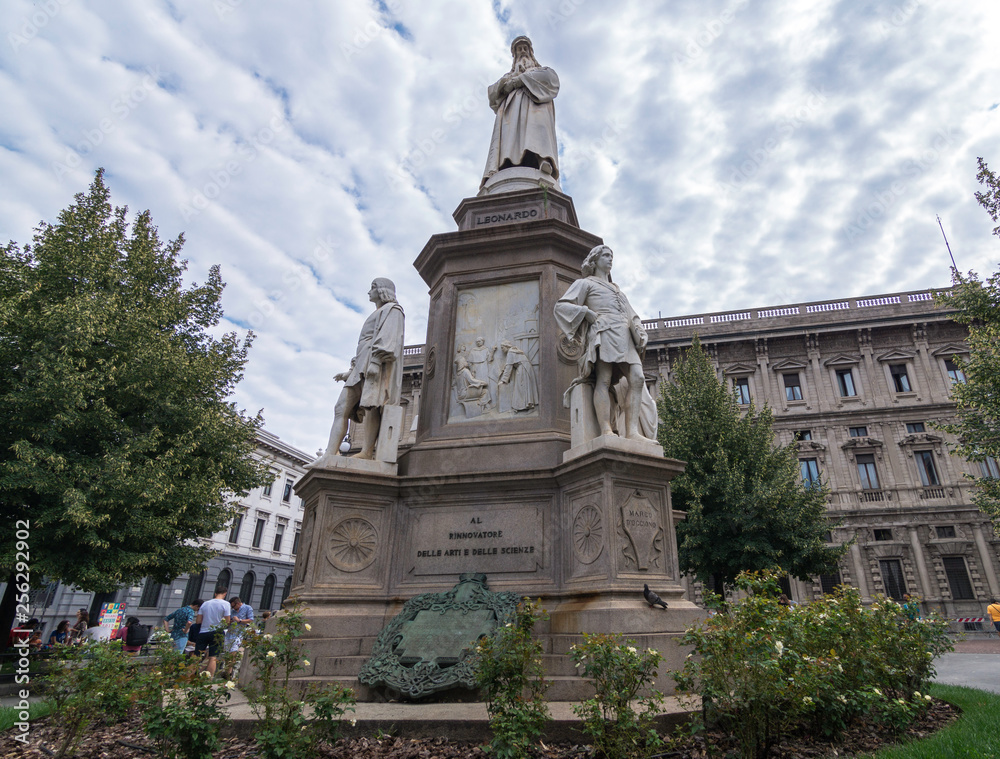  Statue of Leonardo da Vinci with a checkered sky, Milan, Italy