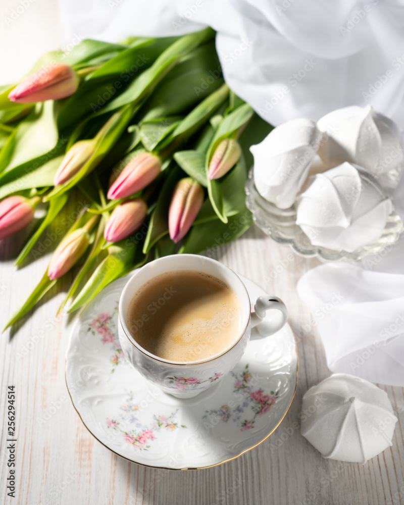 Morning Cup of coffee and a bouquet of tulips. Morning Cup of coffee and a bouquet of tulips.