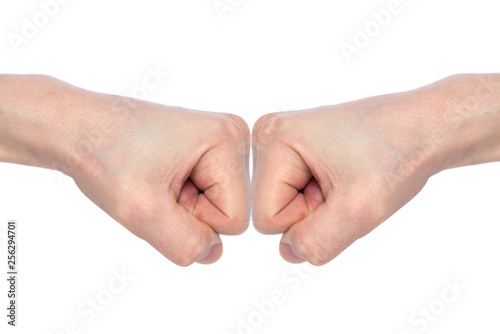 Two male fists hitting each other, isolated on white background. The concept of business success and teamwork. Close-up
