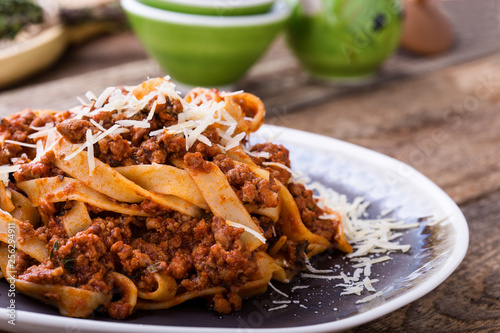 Fettuccine pasta with bolognese sauce and thyme