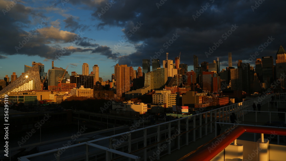 Fototapeta premium Panorama of New York on a cloudy day view from open deck of a cruise ship
