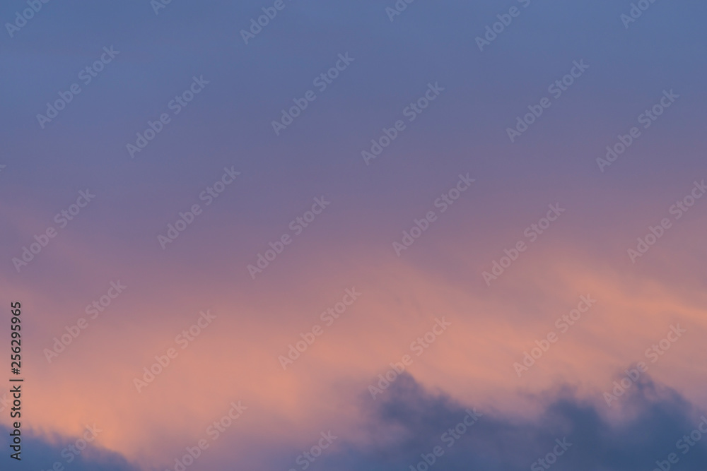 Detail of evening light glowing through clouds creating beautiful colours.