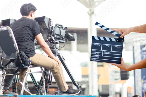 Man hands holding movie clapper.Film director concept.camera show viewfinder image catch motion in interview or broadcast wedding ceremony, catch feeling, stopped motion in best memorial day concept. photo