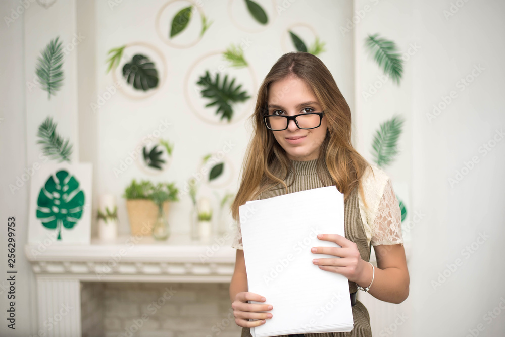 Cute portrait of young designer and florist, student. Employee in the green office Cute portrait of young designer and florist, student. Employee in the green office