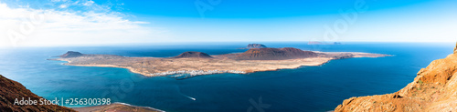 Fotografie Unique panoramic magnificent aerial view of volcanic islands La Graciosa, Montana Clara, Allegranza in Atlantic ocean, from Mirador del Rio, Lanzarote, Canary Islands, Spain