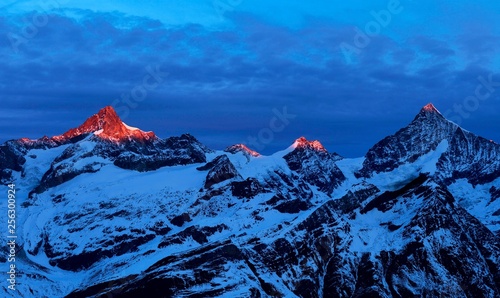 Zinalrothorn with snow in red dawn glow, Dent Blanche right, Gornergrat, Zermatt, Canton of Valais, Switzerland, Europe