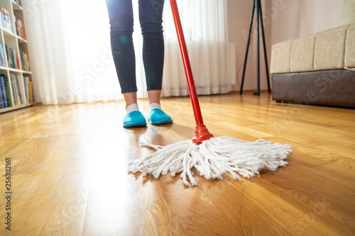 Maid wiping floor