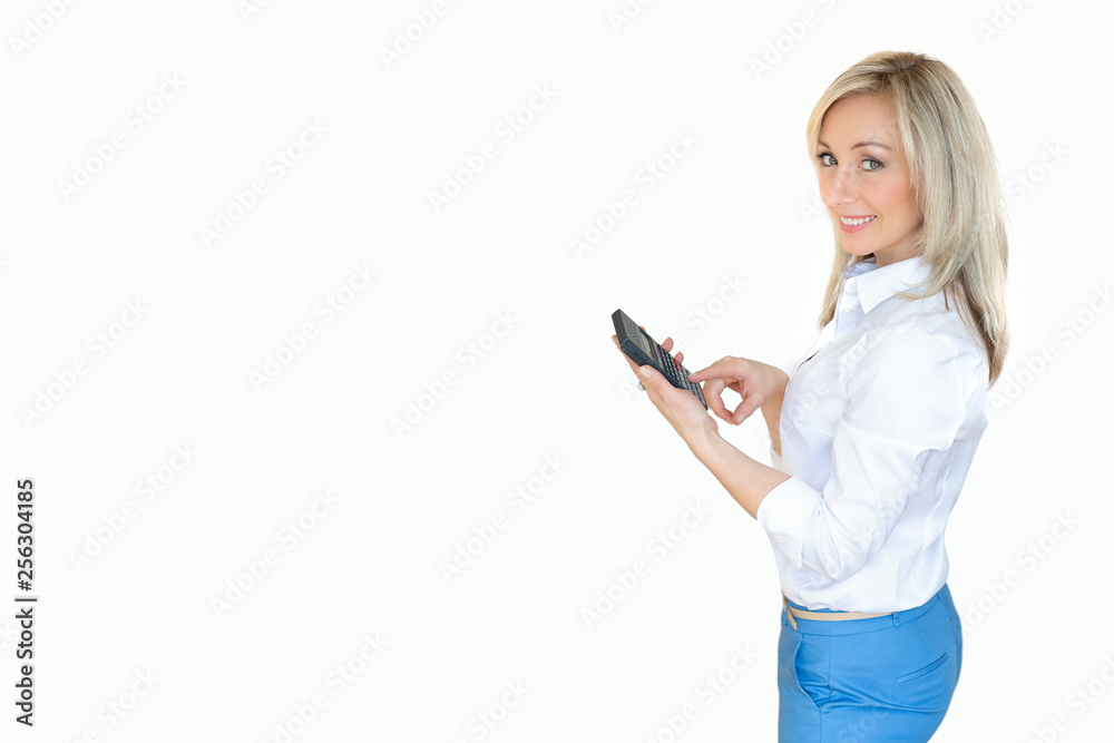 young business lady with a calculator. business portrait of a blonde woman in a blue suit.Business content.Isolated white background. young business lady with a calculator. business portrait of a blonde woman in a blue suit.Business content.Isolated white background.