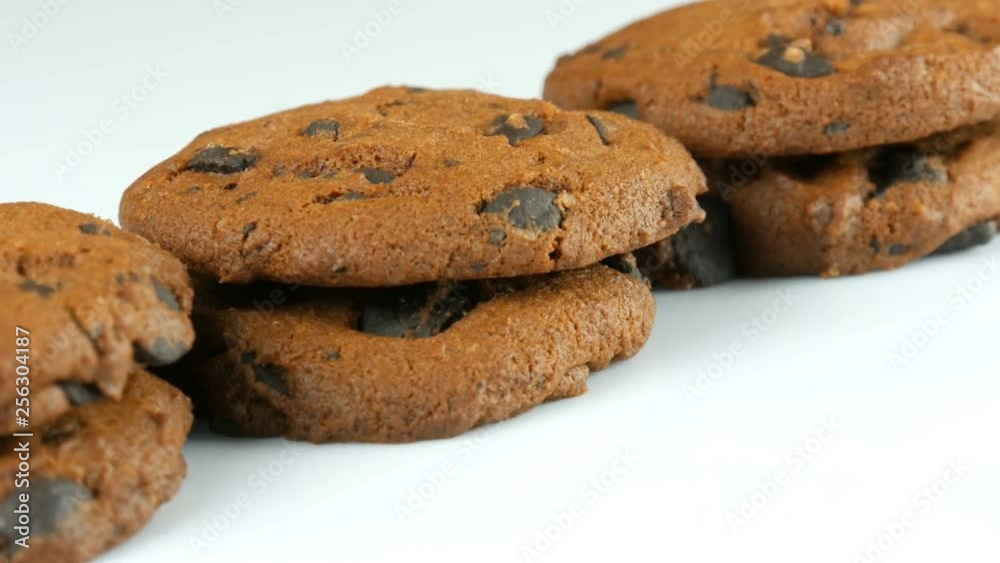 Chocolate cookies on a stylish white background and a mirror surface Chocolate cookies on a stylish white background and a mirror surface