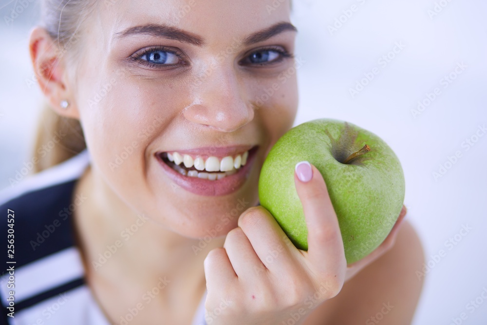 Close up portrait of healthy smiling woman with green apple. Close up portrait of healthy smiling woman with green apple.