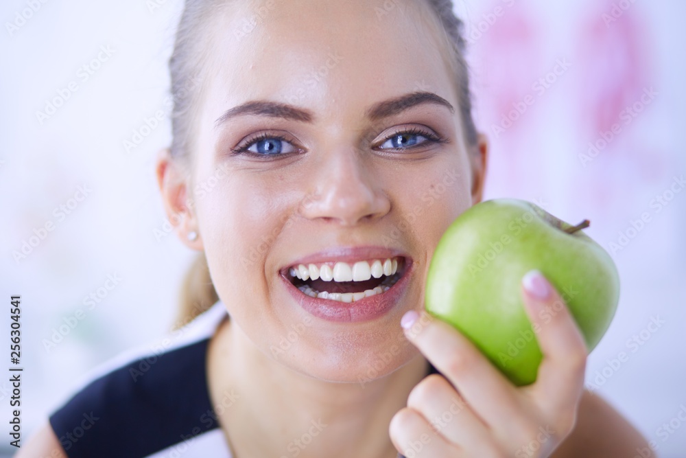 Close up portrait of healthy smiling woman with green apple. Close up portrait of healthy smiling woman with green apple.