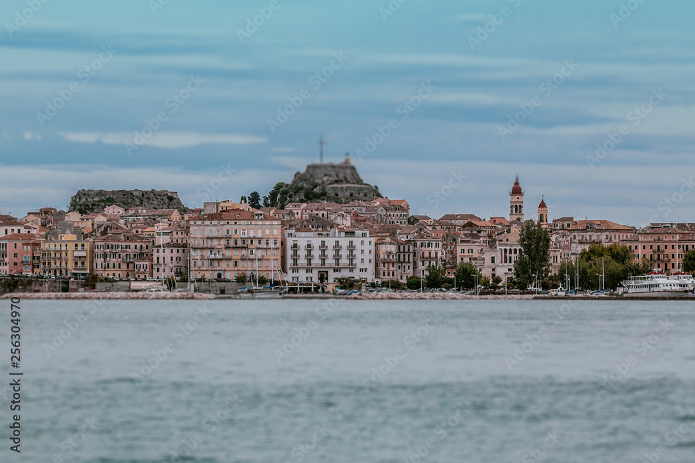 Tilt shift effect of the city of Corfu with venetian Fortress on a rainy day