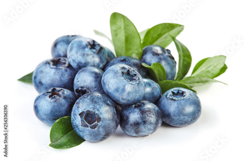 heap of fresh blueberry with leaves isolated on white background