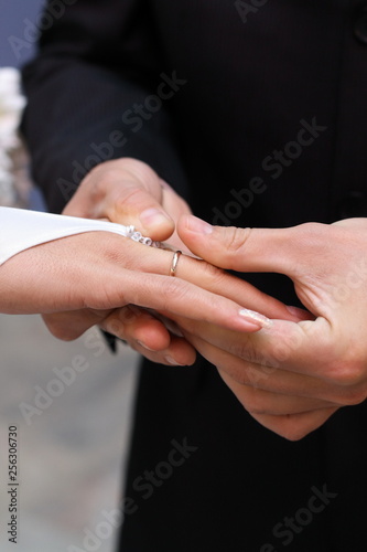 Beautiful closeup of golden wedding ring hand. Wedding ring. Happy couple. Beautiful bride. Valentine gift.