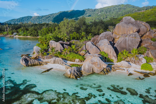 Aerial photo of amazing granite Rocks on beautiful paradise tropical beach Anse Source D Argent at La Digue island, Seychelles. Summer vacation, travel and lifestyle concept